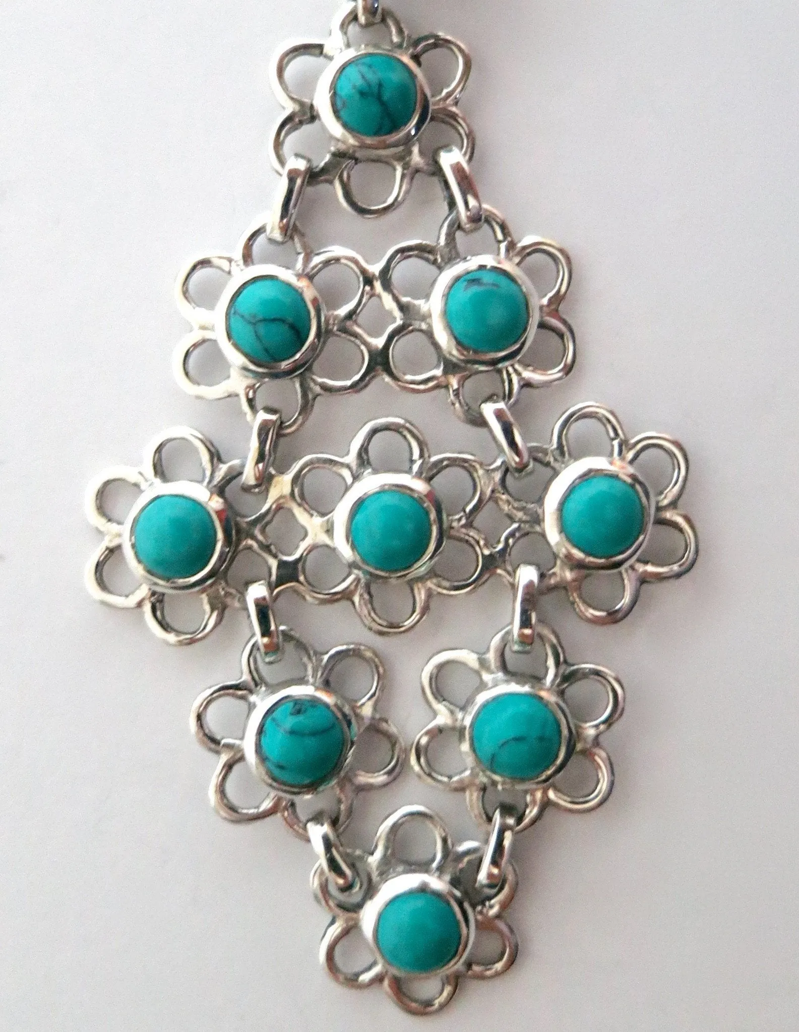 Beautiful and unique, long, flexible, linked floral units Samarkand turquoise earrings