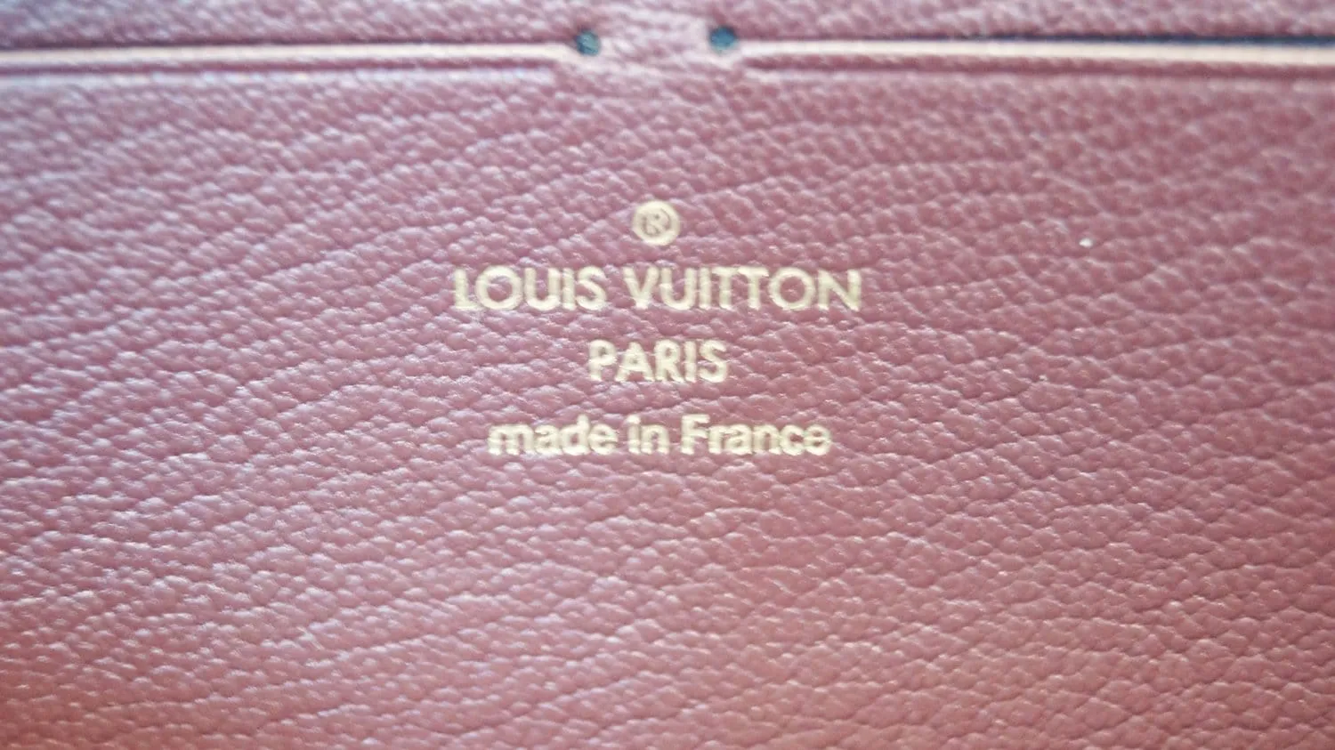 LOUIS VUITTON Burgundy Ostrich Leather Zippy Wallet - Sale