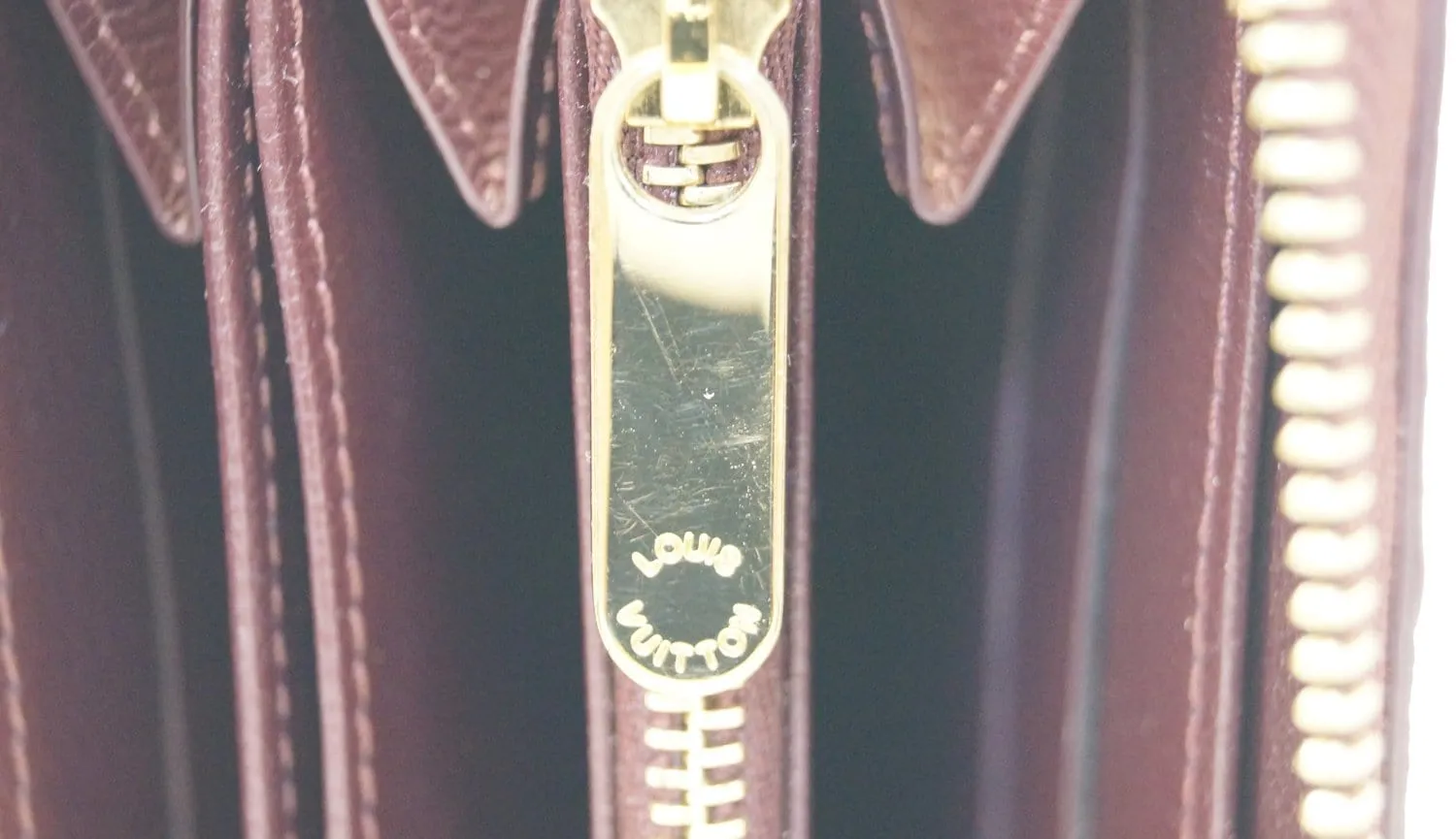 LOUIS VUITTON Burgundy Ostrich Leather Zippy Wallet - Sale