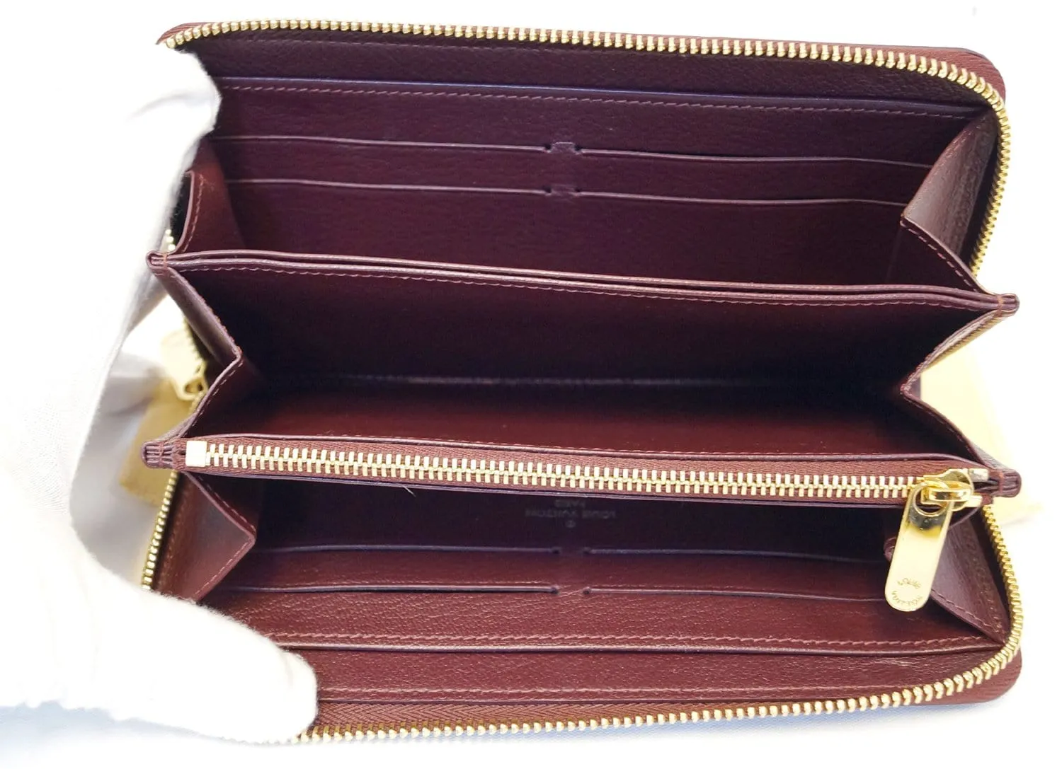 LOUIS VUITTON Burgundy Ostrich Leather Zippy Wallet - Sale