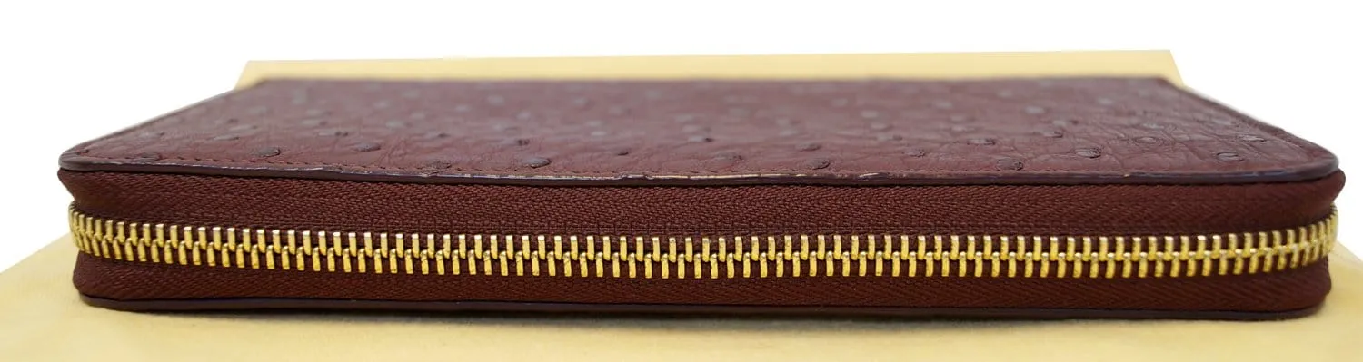 LOUIS VUITTON Burgundy Ostrich Leather Zippy Wallet - Sale