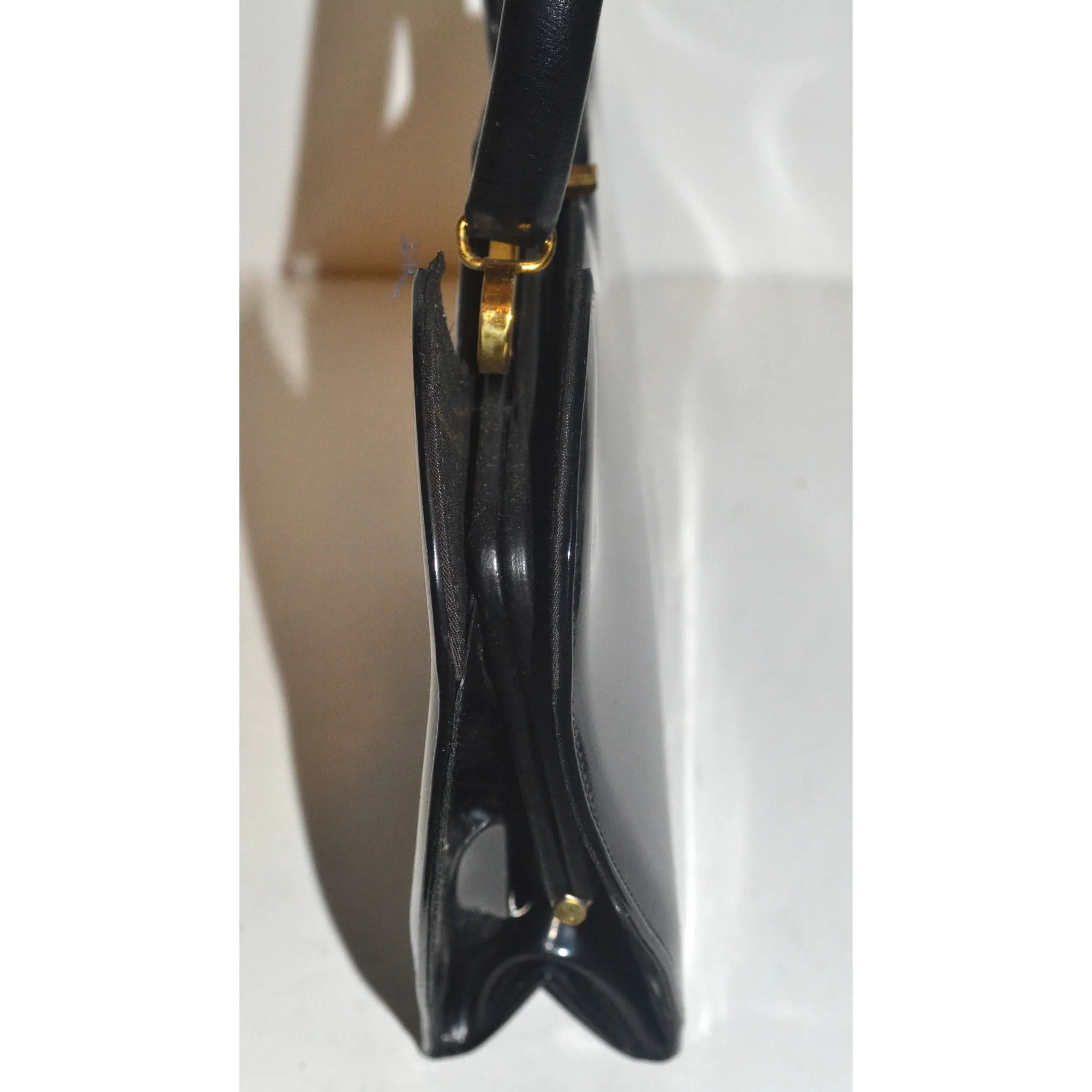 Sleek Black Patent Curved Purse