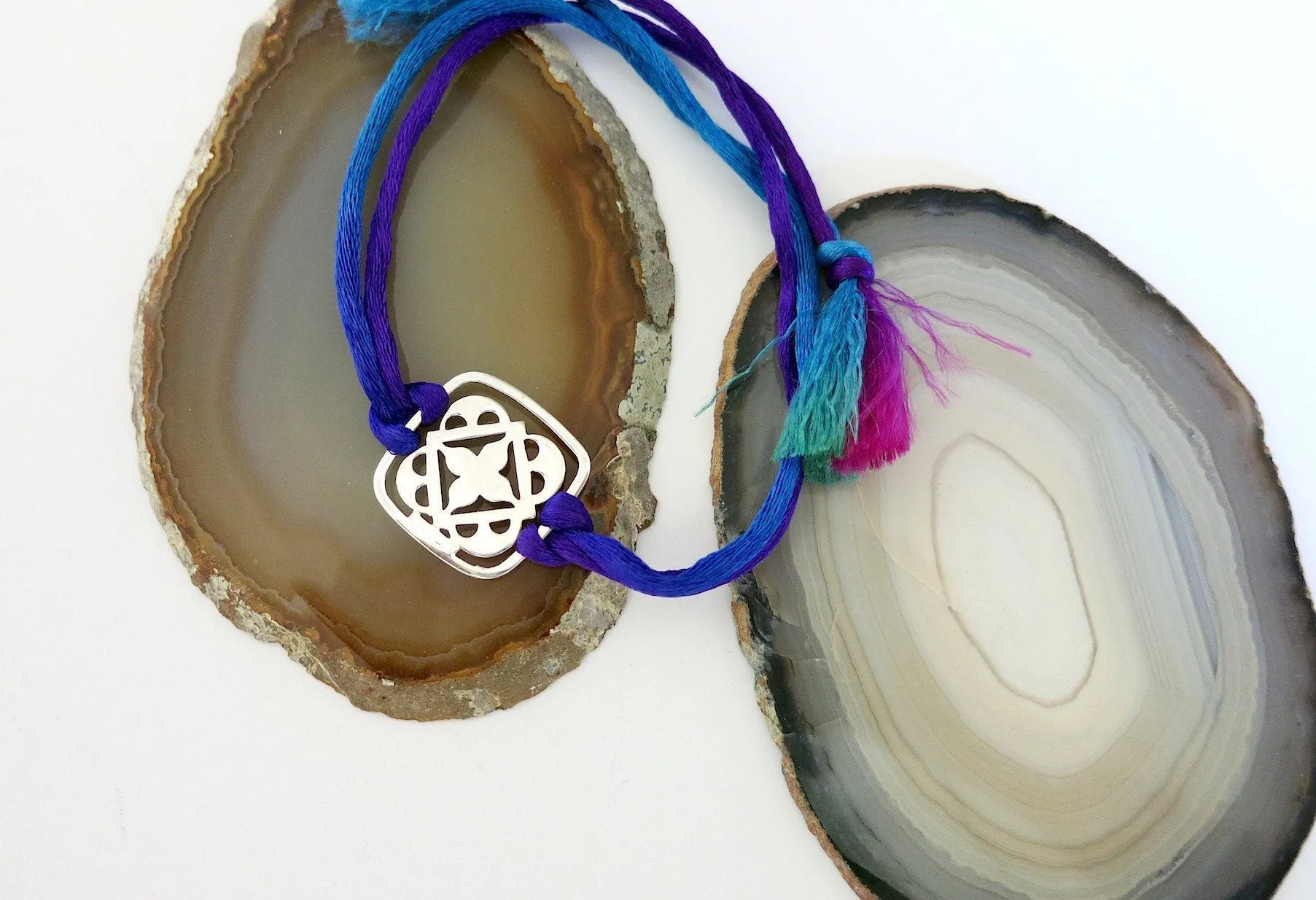Small, rounded square, cutwork Bookmark