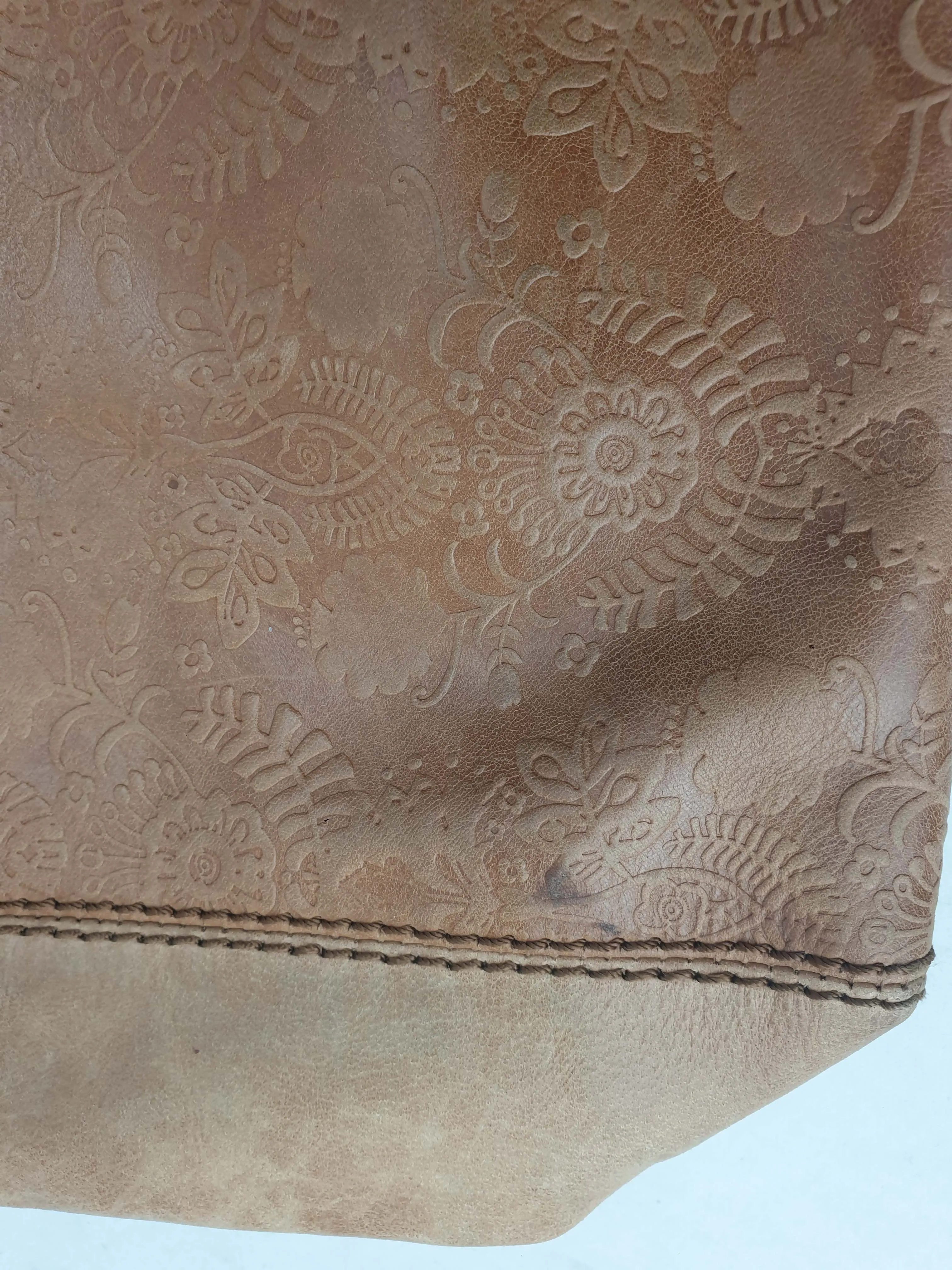 The Sak brown leather cross body bag with subtle floral detail