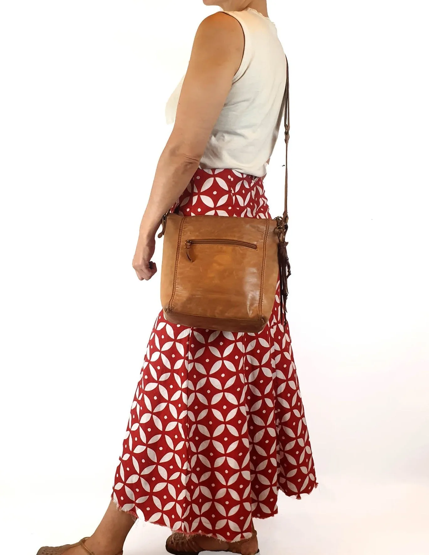 The Sak brown leather cross body bag with subtle floral detail