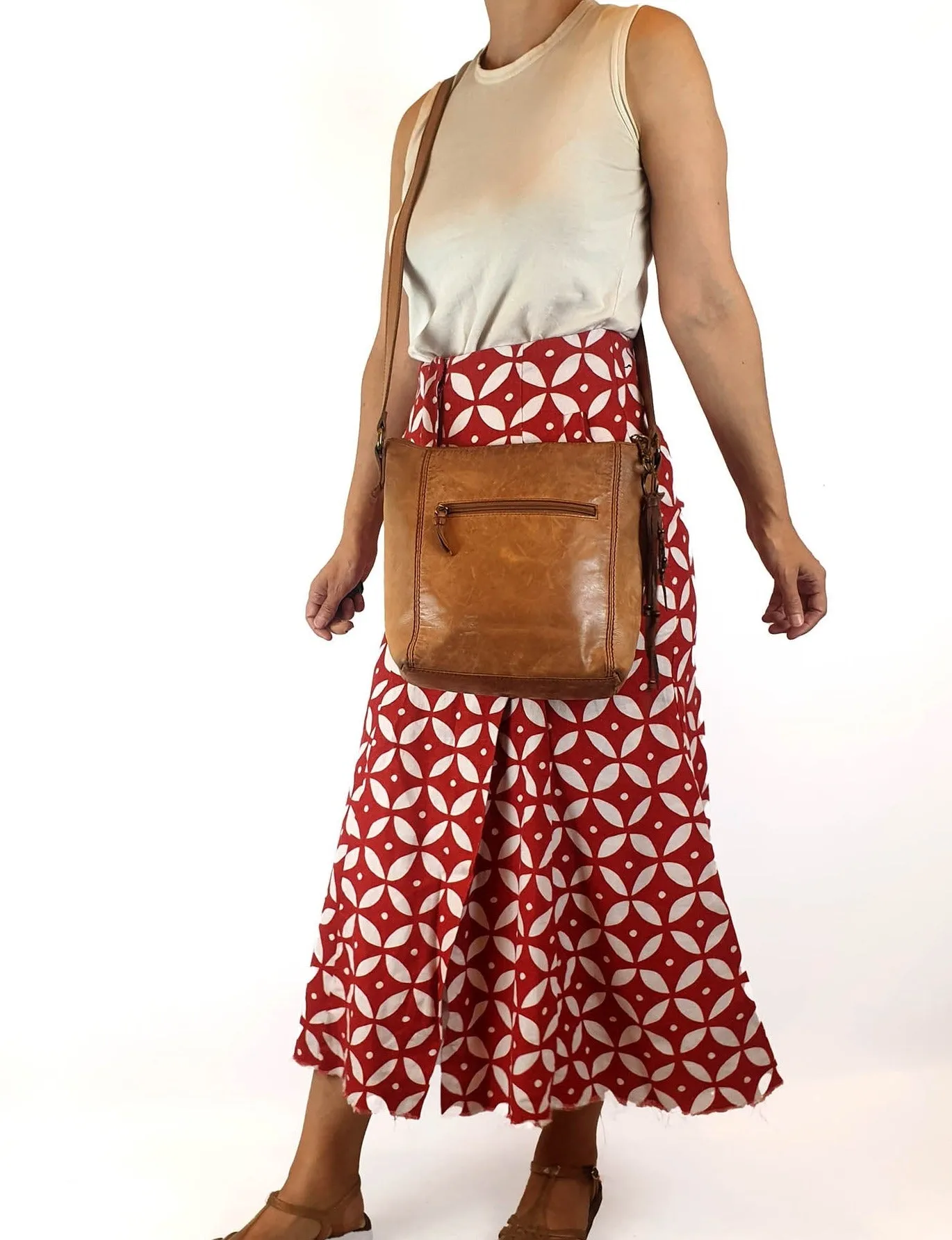 The Sak brown leather cross body bag with subtle floral detail