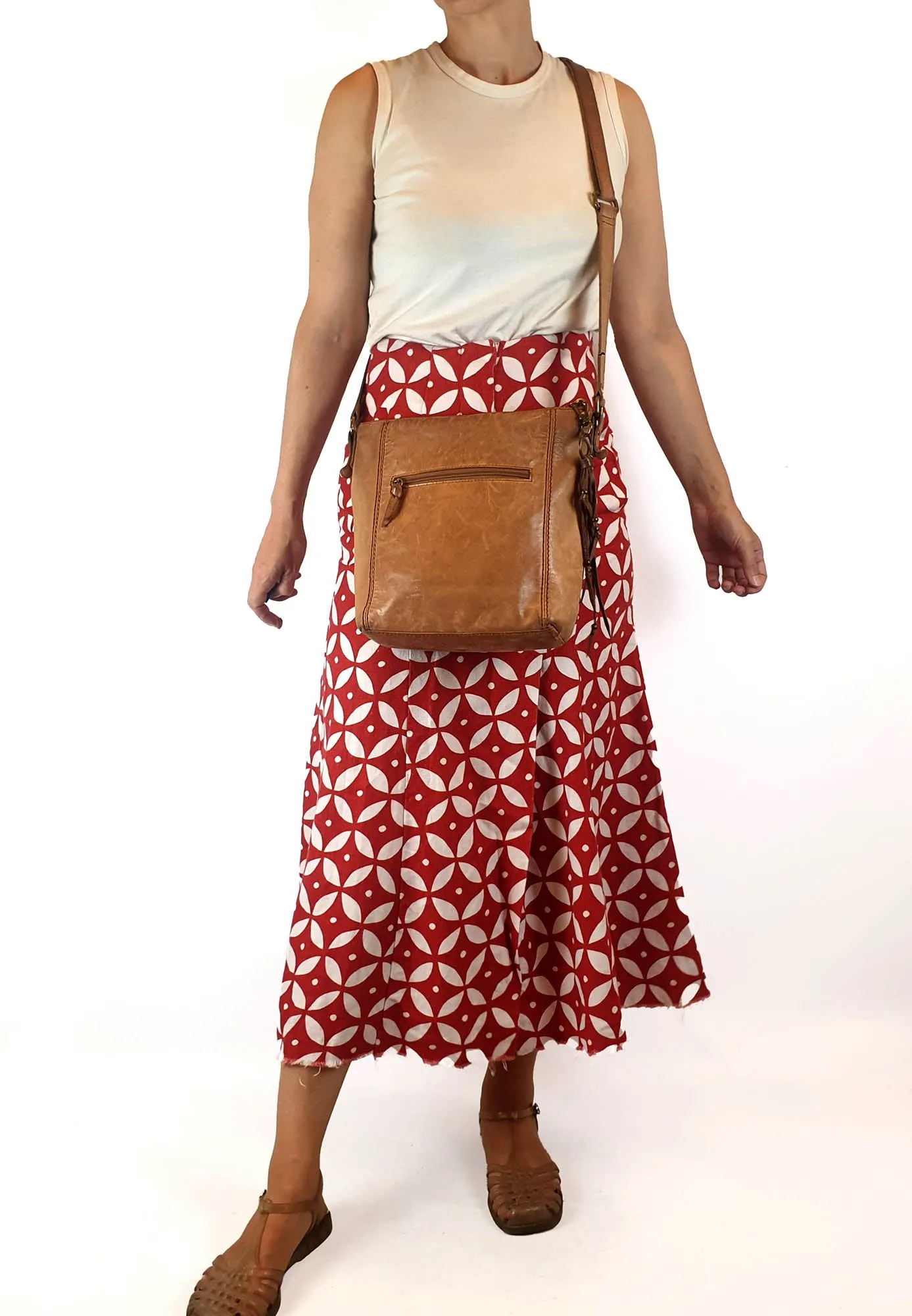 The Sak brown leather cross body bag with subtle floral detail