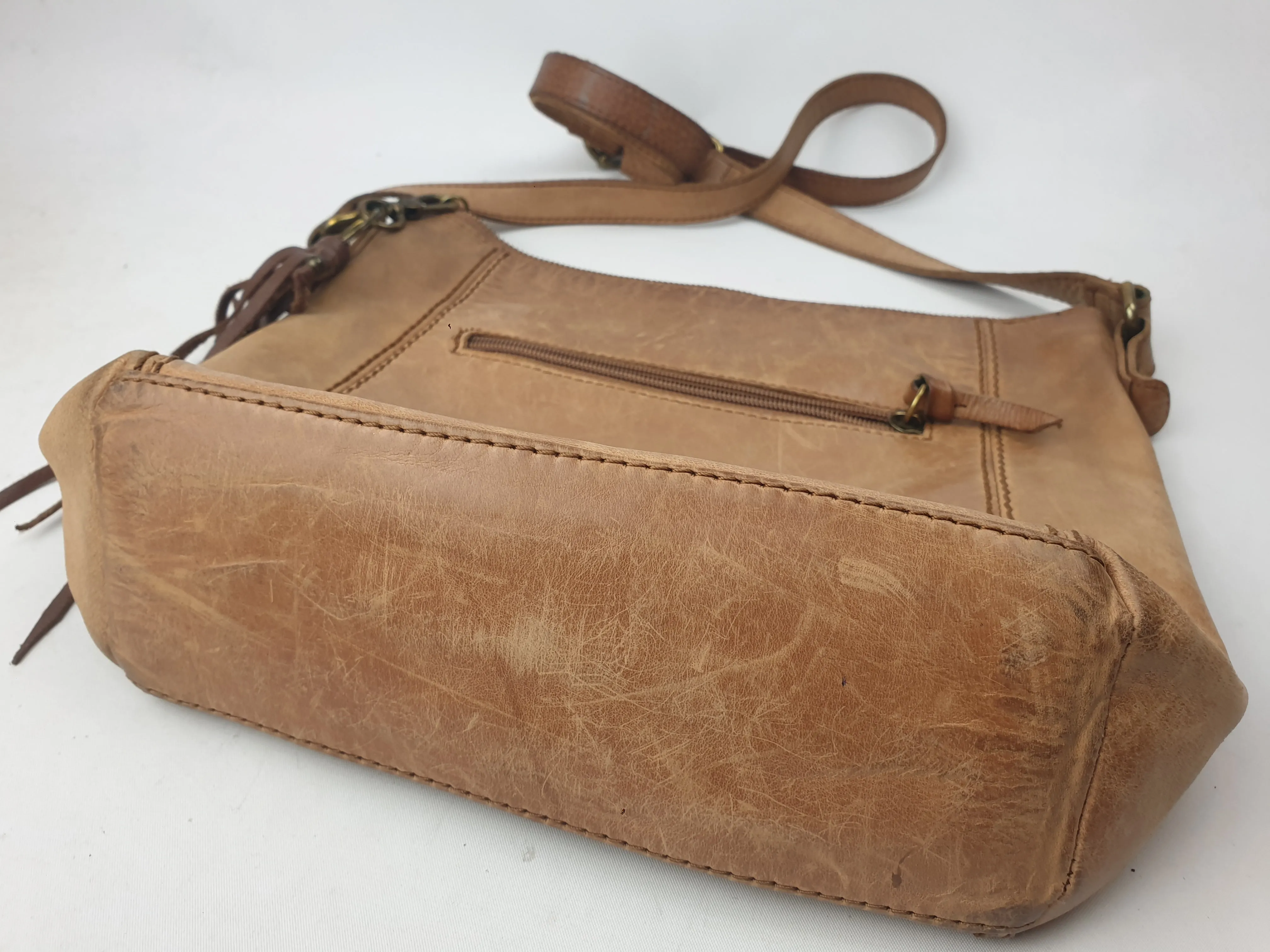 The Sak brown leather cross body bag with subtle floral detail