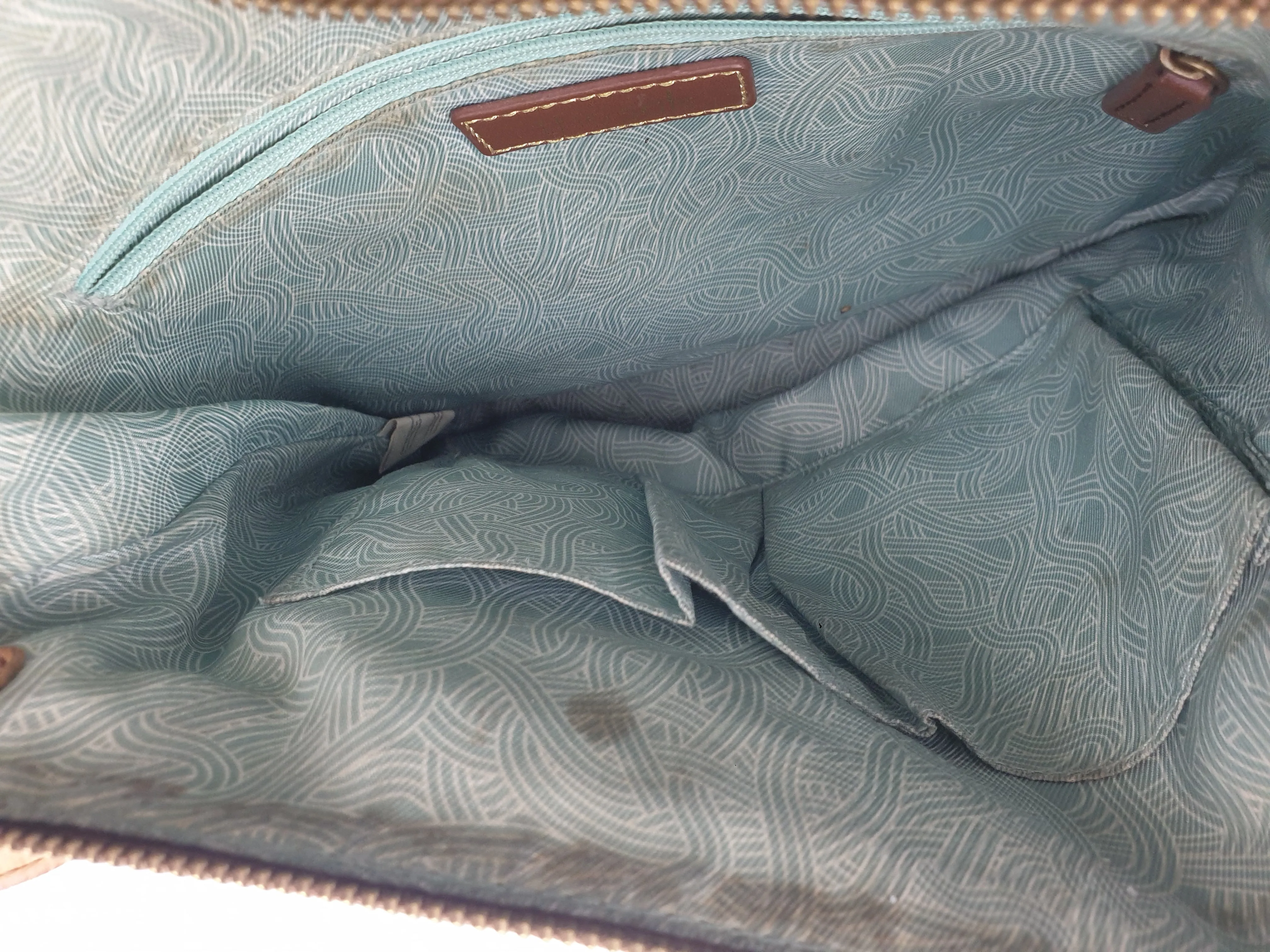 The Sak brown leather cross body bag with subtle floral detail