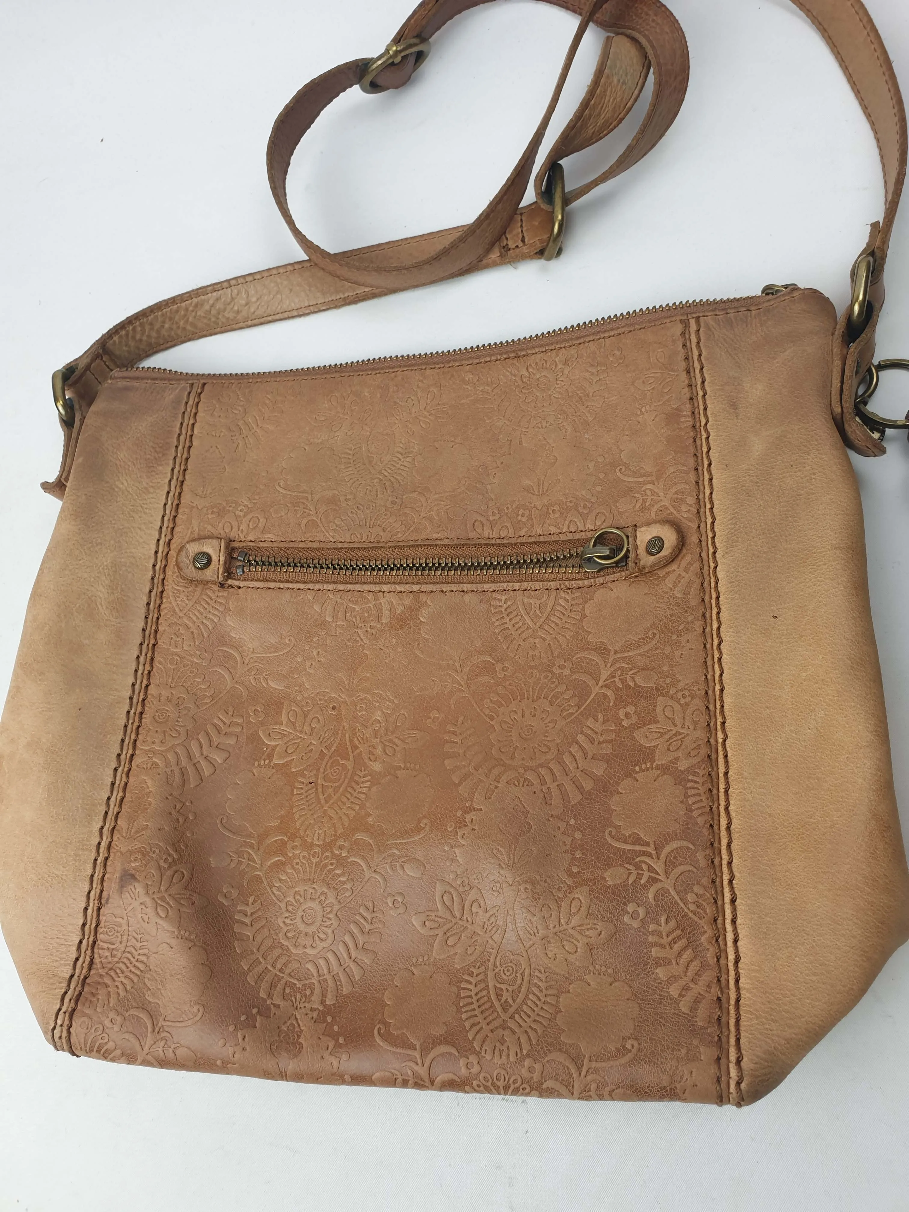 The Sak brown leather cross body bag with subtle floral detail