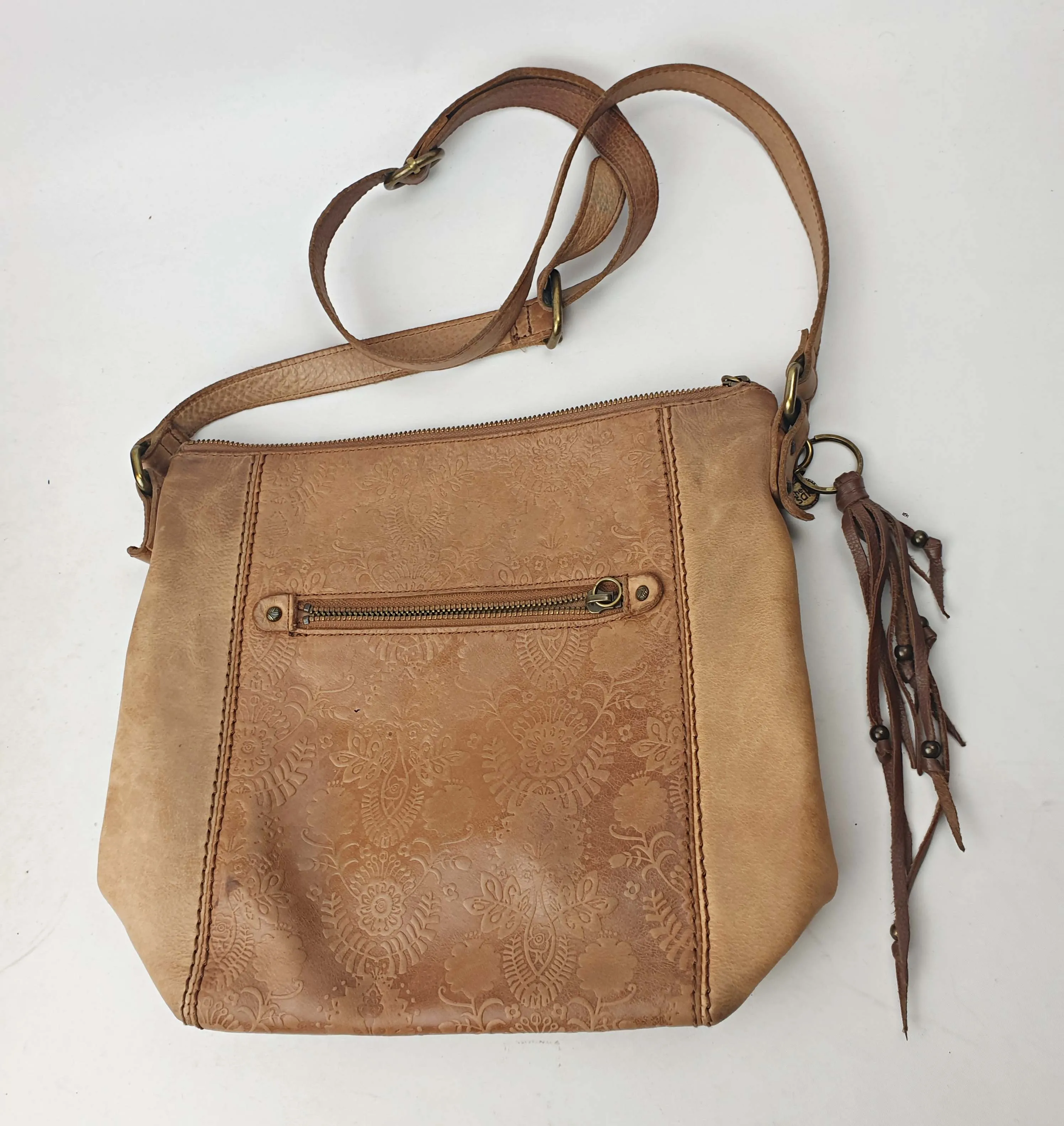 The Sak brown leather cross body bag with subtle floral detail