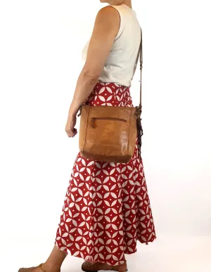 The Sak brown leather cross body bag with subtle floral detail
